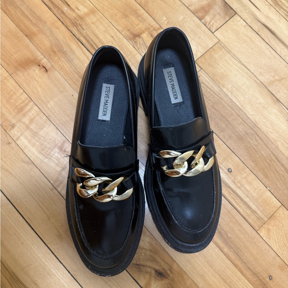 Steve Madden Glossy Black Loafers with Gold Accent